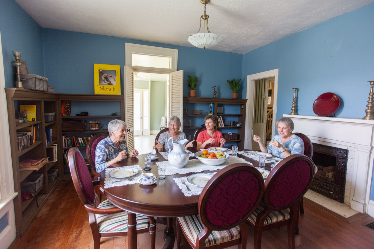 Community gathering around dining table